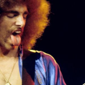 Journey guitarist Neal Schon performing