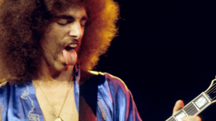 Journey guitarist Neal Schon performing