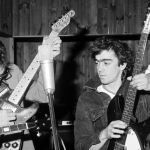 R.E.M. members playing instruments together