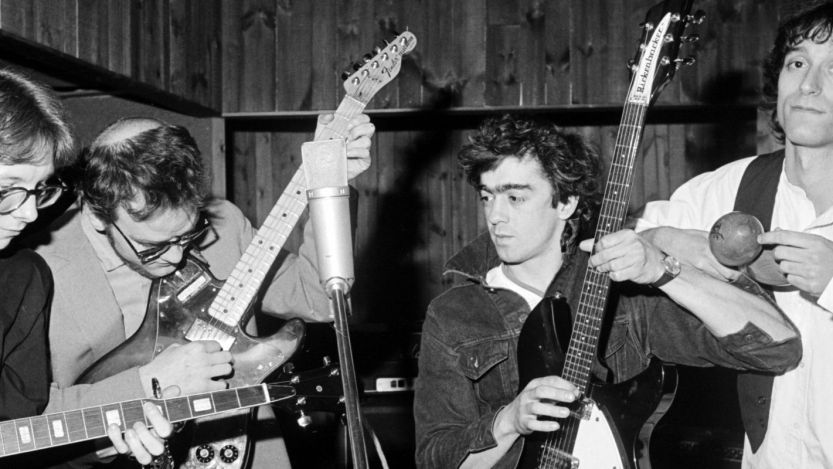 R.E.M. members playing instruments together