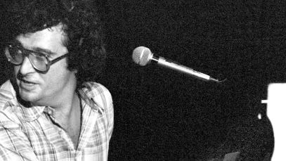 Randy Newman playing piano