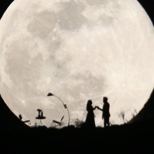 KAYSERI, TURKEY - FEBRUARY 19: A couple dance on a hill as the Supermoon is seen in Turkey's Kayseri on February 19, 2019. The Supermoon is a full moon that almost coincides with the closest distance that the Moon reaches to Earth in its elliptic orbit, resulting in a larger-than-usual visible size of the lunar disk as seen from Earth. (Photo by Sercan Kucuksahin/Anadolu Agency/Getty Images)