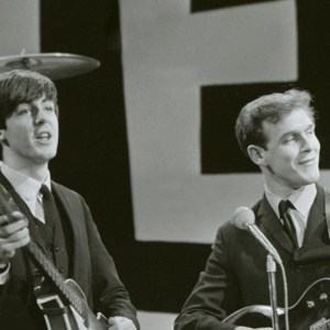 The Beatles rehearse for their appearance on the Ed Sullivan TV Show in New York. George Harrison was bed ridden so roadie Neil Aspinall stood in for the rehearsal with George returning for the live TV broadcast. Neil plays lead guitar with Paul McCartney and Ringo Starr. 8th February 1964. (Photo by Smith/Daily Herald/Mirrorpix via Getty Images)