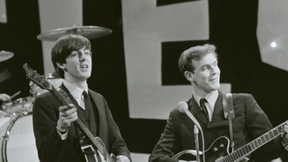 The Beatles rehearse for their appearance on the Ed Sullivan TV Show in New York. George Harrison was bed ridden so roadie Neil Aspinall stood in for the rehearsal with George returning for the live TV broadcast. Neil plays lead guitar with Paul McCartney and Ringo Starr. 8th February 1964. (Photo by Smith/Daily Herald/Mirrorpix via Getty Images)