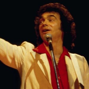 Country singer Ronnie Prophet on stage, 1983. (Photo by David Redfern/Redferns/Getty Images)