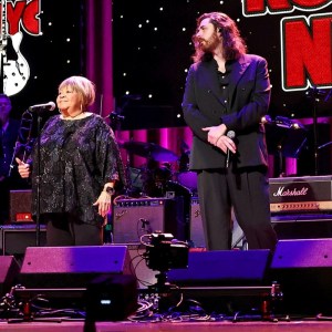 Watch Elvis Costello, Mavis Staples, Hozier, & Warren Haynes Team Up for an Unforgettable Performance of The Band’s “The Weight”
