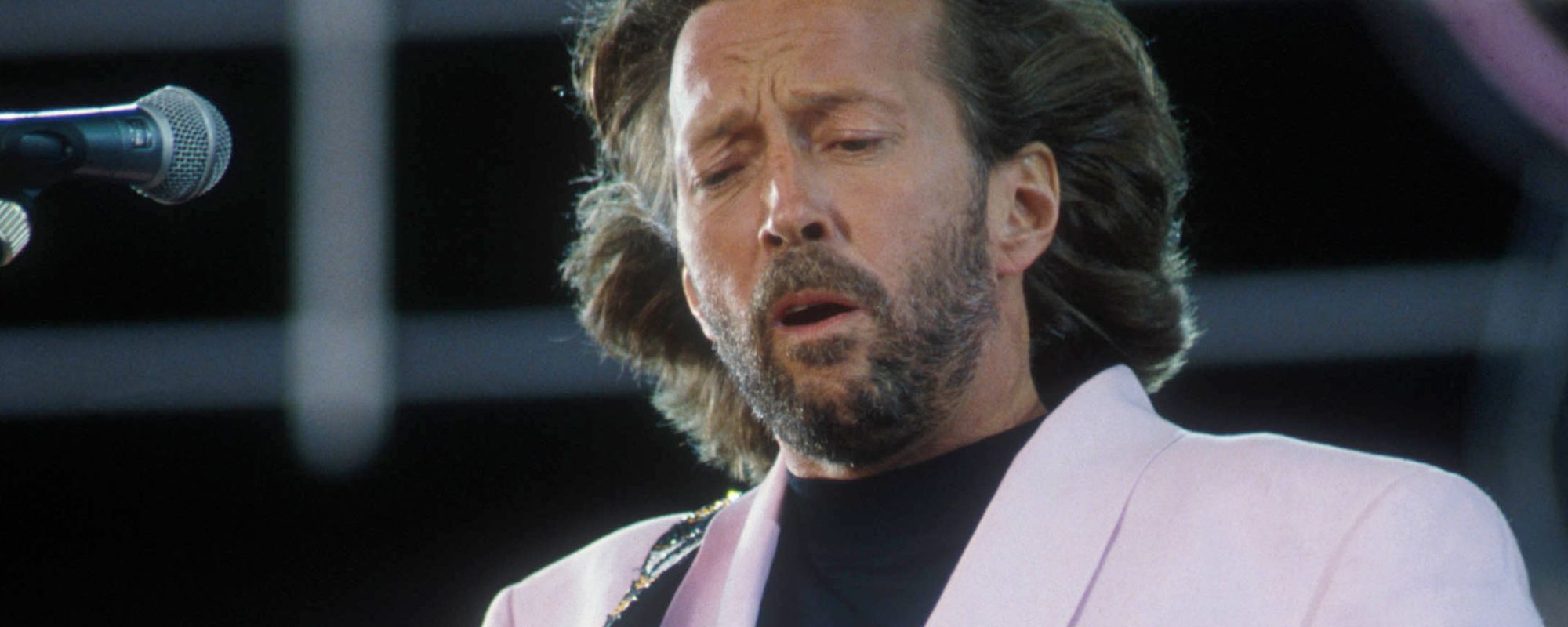 On Stage 36 Years Ago, Eric Clapton Appears on ‘SNL’ to Perform a Song About His and George Harrison’s Ex-Wife