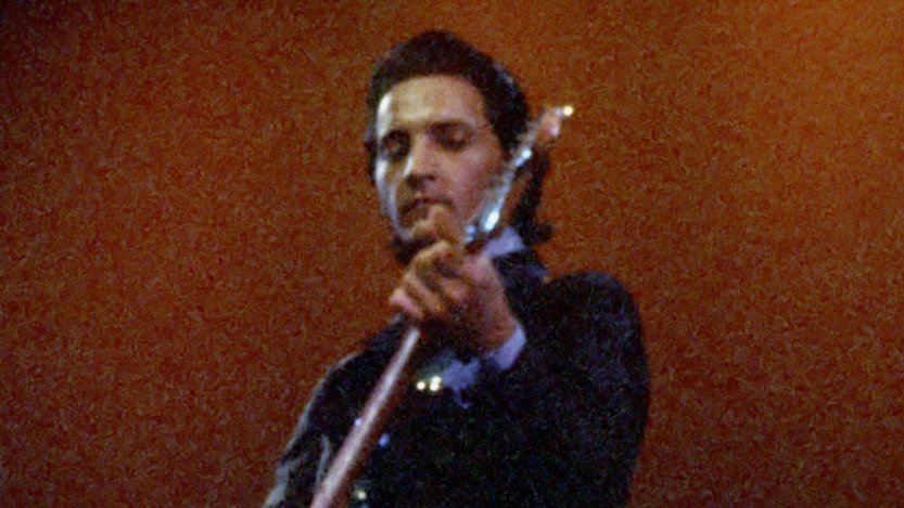 Bob Wootton on stage with Johnny Cash