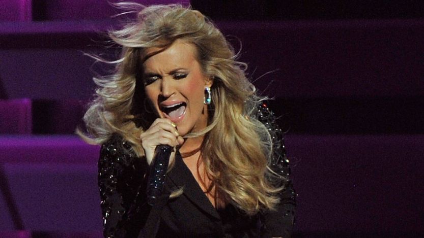 Watch Carrie Underwood ”Blow the Roof” off Guns N Roses Classic in This Thrashing Throwback