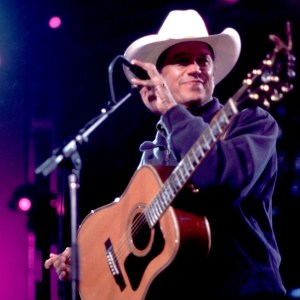American Country musician George Strait plays guitar as he performs onstage at the Tweeter Center, Tinley Park, Illinois, May 5, 2001. (Photo by Paul Natkin/Getty Images)