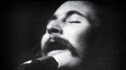 David Crosby of rock band “The Byrds” performing in a club in a profile view, eyes closed, head back with a mic, circa 1967 in Los Angeles, California. (Photo by Sulfiati Magnuson/Getty Images)