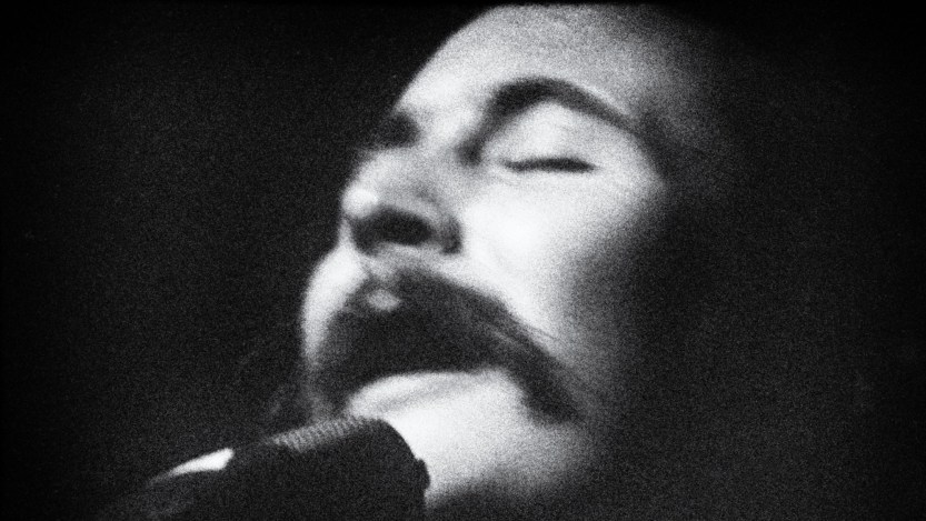 David Crosby of rock band “The Byrds” performing in a club in a profile view, eyes closed, head back with a mic, circa 1967 in Los Angeles, California. (Photo by Sulfiati Magnuson/Getty Images)