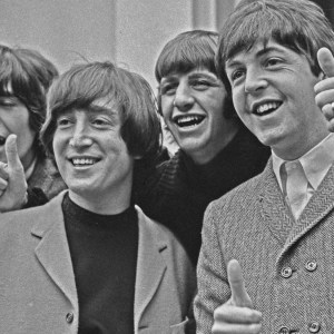 British rock group the Beatles pose outside Abbey Road Studios in London, after John Lennon passed his driving test, UK, 16th February 1965. From left to right, George Harrison, John Lennon, Ringo Starr and Paul McCartney. (Photo by Evening Standard/Hulton Archive/Getty Images)