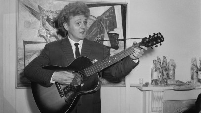 Rock and Roll musician and singer Wee Willie Harris playing an acoustic guitar, July 21st 1958. (Photo by Daily Express/Hulton Archive/Getty Images)