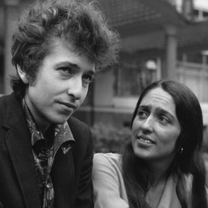 (Original Caption) Folk singer Bob Dylan in London. Popular folk singer Bob Dylan, who arrived in London last night for his British Tour, pictured this afternoon in the Embankment Gardens with Joan Baez, who is also a popular American folk singer. Joan has a concert on the 23rd of May. (Photo by Hulton-Deutsch/Hulton-Deutsch Collection/Corbis via Getty Images)