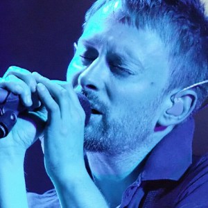 Thom Yorke of British rock group Radiohead performs on the main stage at the V Festival near Chelmsford in Essex, 19 August 2006. Radiohead announced Monday 01 October 2007 that they will be selling their latest album at a bargain price: whatever the customer wants to pay for the download. "It's up to you" says a website message instead of a price for the record, "In Rainbows," to be released on 10 October 2007, although a hard copy packaged version will also be available for 40 pounds. AFP PHOTO/LEON NEAL (Photo credit should read Leon Neal/AFP via Getty Images)