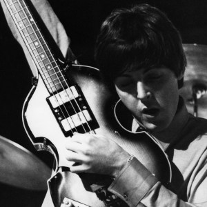 Paul McCartney of English rock and pop group The Beatles tunes up his Hofner 500/1 violin bass guitar on stage during rehearsals for the ABC Television music television show 'Thank Your Lucky Stars' Summer Spin at Teddington Studios in London on 11th July 1964. The band would go on to play four songs on the show, A Hard Day's Night, Long Tall Sally, Things We Said Today and You Can't Do That. (Photo by David Redfern/Redferns)