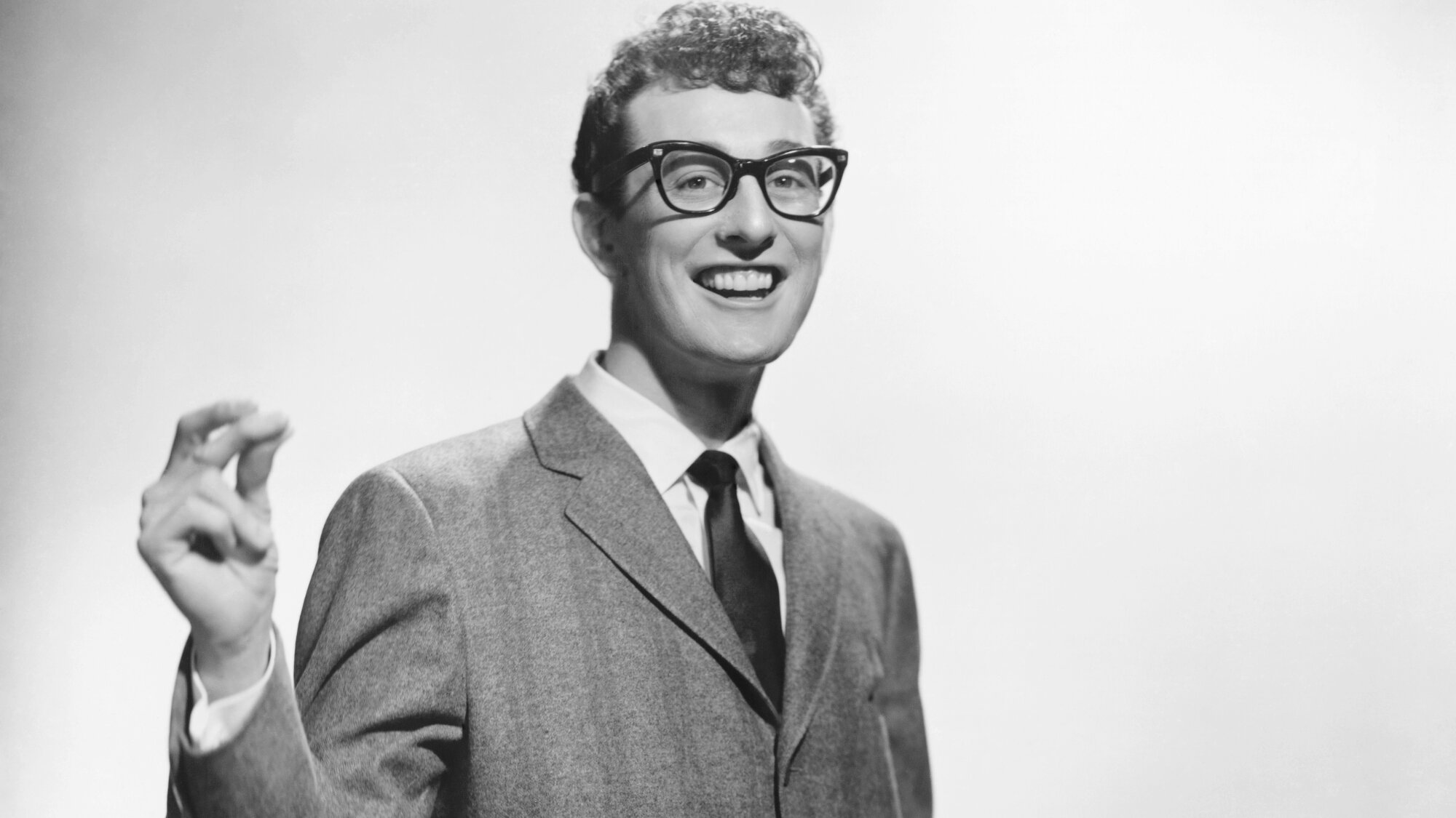 On This Day in 1959, Buddy Holly Made Music History With This Posthumous No. 1 Hit—Penned by His “Nemesis”