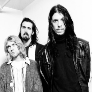 (MANDATORY CREDIT Gutchie Kojima/Shinko Music/Getty Images) Nirvana, group portrait, backstage at Nakano Sunplaza, Tokyo, Japan, 19th December 1992. (From left) Kurt Cobain, Krist Novoselic, Dave Grohl. (Photo by Gutchie Kojima/Shinko Music/Getty Images)