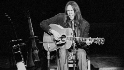 Neil Young performs on stage at the Royal Festival Hall, London on his 'Journey Through The Past' solo tour, 27th February 1971. (Photo by Gijsbert Hanekroot/Redferns)