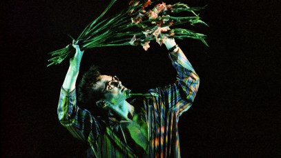 LONDON, UNITED KINGDOM - MARCH 12: Morrissey of The Smiths waves a bunch of gladioli while performing on stage at Hammersmith Palais, on March 12th, 1984 in London, England. (Photo by Pete Still/Redferns)