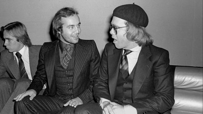 View of English Rock & Pop songwriting duo, lyricist Bernie Taupin (second right) and musician Elton John (right) at the Studio 54 nightclub, New York, New York, 1970s. The men at left are unidentified. (Photo by Allan Tannenbaum/Getty Images)