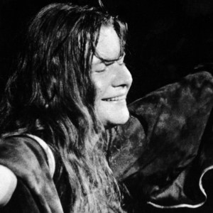 Circa 1967, American singer Janis Joplin (1943 - 1970) closes her eyes and outstretches her arms during a performance, late 1960s. (Photo by Getty Images/Getty Images)