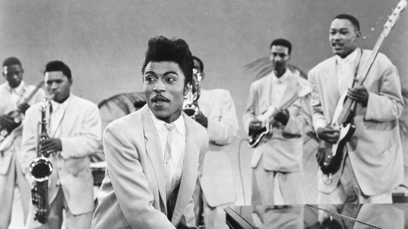 CIRCA 1957: Musician Little Richard performs onstage with his band as his saxophone player Grady Gaines stands on the piano in circa 1957 in scene from the movie 'Mister Rock And Roll.' (Photo by Michael Ochs Archives/Getty Images)