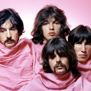 LOS ANGELES - AUGUST 1968: Psychedelic rock group Pink Floyd pose for a portrait shrouded in pink in August of 1968 in Los Angeles. (L-R) Nick Mason, Dave Gilmour, Rick Wright (center front), Roger Waters. (Photo by Michael Ochs Archives/Getty Images)