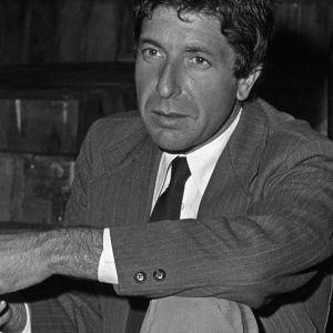Leonard Cohen sitting down