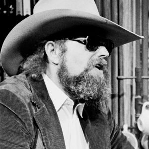 Charlie Daniels talking at bar