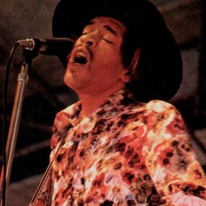 Jimi Hendrix performing at pop festival