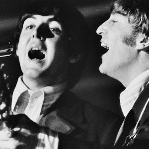 Paul McCartney and John Lennon performing