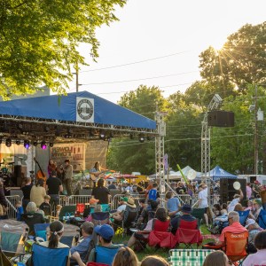Festival goers watch the main stage at the Lower Town Arts and Music Festival