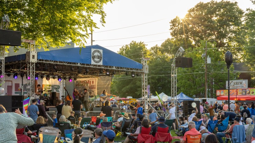 Festival goers watch the main stage at the Lower Town Arts and Music Festival