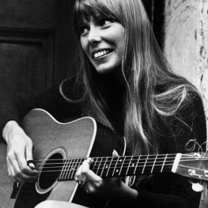 Joni Mitchell playing guitar