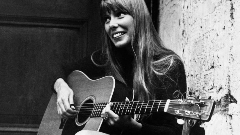 Joni Mitchell playing guitar