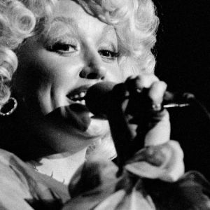 Dolly Parton performing in 1977