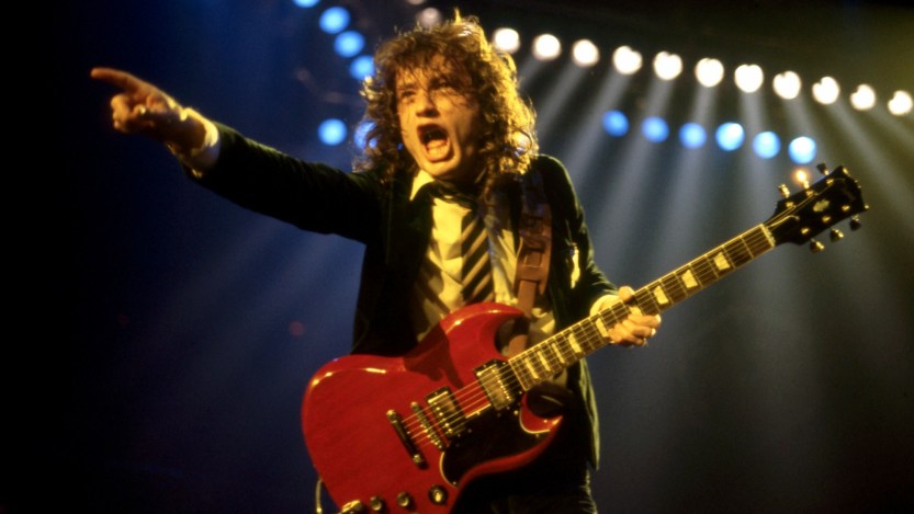 DETROIT - NOVEMBER 17: Angus Young, the Australian musician, best known as the co-founder, lead guitarist, and songwriter of the Australian hard rock band AC/DC, onstage at the Joe Louis Arena during the band's "Flick of the Switch/Monsters of Rock" tour, on November 17, 1983, in Detroit, Michigan. (Photo by Ross Marino/Getty Images)