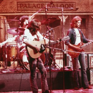 American soft-rock ensemble The Eagles perform on stage before a faux Old West backdrop, 1974. Members of the band are (left to right) bassist Randy Meisner, drummer Don Henley, guitarist Glenn Frey, guitarist Don Felder, and guitarist Bernie Leadon. All members also sang. (Photo by Fotos international/Getty Images)