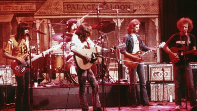 American soft-rock ensemble The Eagles perform on stage before a faux Old West backdrop, 1974. Members of the band are (left to right) bassist Randy Meisner, drummer Don Henley, guitarist Glenn Frey, guitarist Don Felder, and guitarist Bernie Leadon. All members also sang. (Photo by Fotos international/Getty Images)