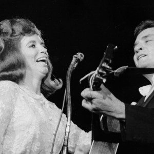 LOS ANGELES - 1968: Married country singers Johnny Cash and June Carter Cash perform onstage in 1968 in Los Angeles, California. (Photo by Michael Ochs Archives/Getty Images)