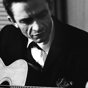 NEW YORK - JULY 1965: Country singer Johnny Cash warms up backstage at the New York Folk Festival in July of 1965 at Carnegie Hall in New York, New York. (Photo by Don Paulsen/Michael Ochs Archives/Getty Images)