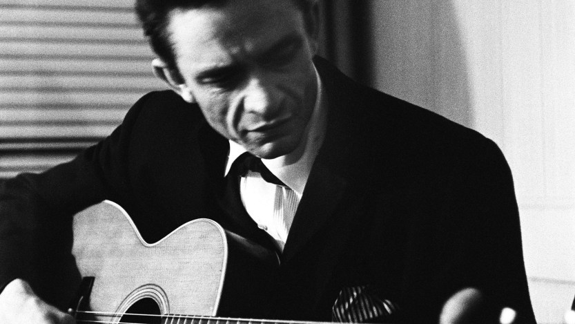 NEW YORK - JULY 1965: Country singer Johnny Cash warms up backstage at the New York Folk Festival in July of 1965 at Carnegie Hall in New York, New York. (Photo by Don Paulsen/Michael Ochs Archives/Getty Images)