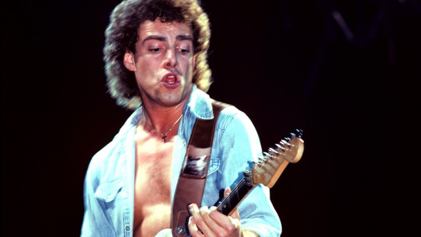 (MANDATORY CREDIT Ebet Roberts/Getty Images) NEW JERSEY - MAY 7: Neal Schon of Journey performs on stage at Meadowlands on May 7, 1982 in East Rutherford, New Jersey. (Photo by Ebet Roberts/Redferns)