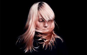 Listen: Canadian Electro-Trio Austra Covers “Woodstock”