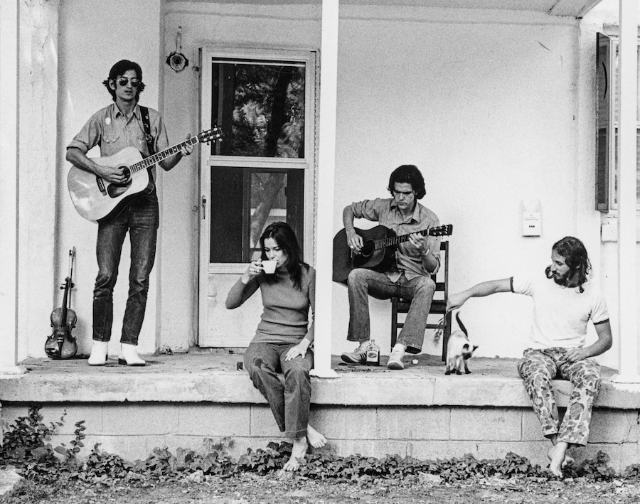 Townes Van Zandt, Susanna Clark, Guy Clark and Daniel Antopolsky on the porch at Guy and Susanna's house on Chapel Avenue. 1972