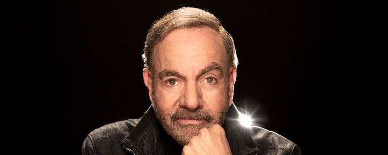 Neil Diamond, the singer and songwriter of "Sweet Caroline," looks directly at the camera.
