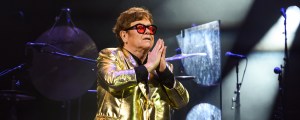 Elton John Remembers Late “Genius” Barry Humphries: “One of the Funniest People in the World”