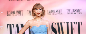 Look: Taylor Swift Kisses Travis Kelce in New Photo Shared by Chiefs Star’s Barber